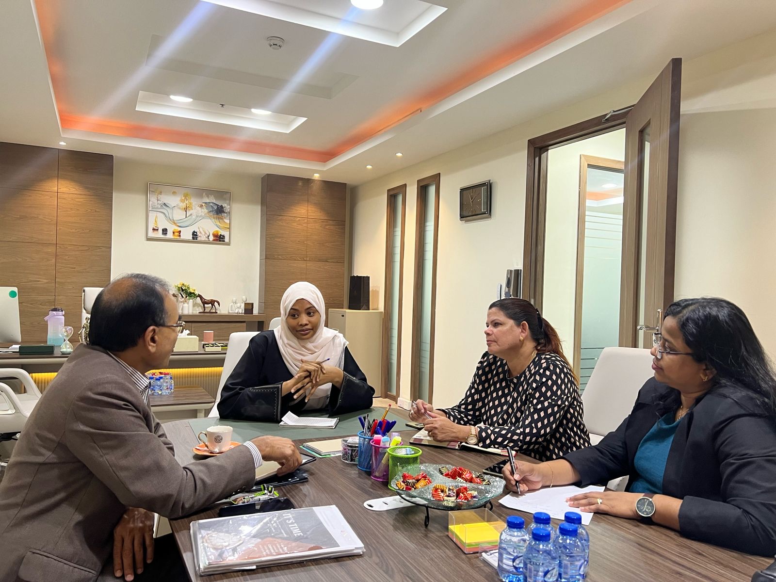 Tasabeeh Adams conducting a client consultation at the Dubai office